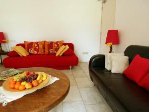 a living room with a plate of fruit on a table at Lovely Farmhouse in Wijlre with Forest nearby in Wijlre
