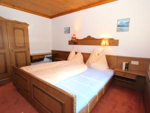 a bedroom with a large bed in a room at Modern Holiday Home in Maria Alm near Ski Area in Maria Alm am Steinernen Meer