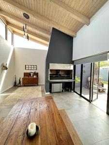 a living room with a table and a fireplace at The Elegant Beach House in Swakopmund