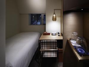 เตียงในห้องที่ Shinjuku Granbell Hotel