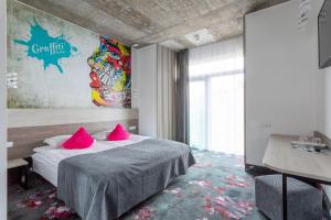 Postel nebo postele na pokoji v ubytování Algiro Hotel