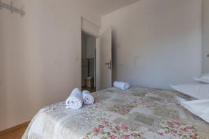 Postel nebo postele na pokoji v ubytování Apartments Senka