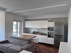 a kitchen with a couch and a table in a room at Residence Tufilla in Ascoli Piceno