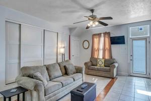 a living room with a couch and a chair at Charming 1st floor apt in the heart of Springfield in Jacksonville