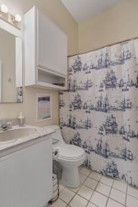 a bathroom with a toilet and a sink at LT Stay Discounts! Cozy 2 BR Apt - Pet Friendly! in Jacksonville
