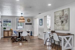 a kitchen and dining room with a table and chairs at Spacious Home w Pool-Tucked Away in Jax Beach in Jacksonville Beach