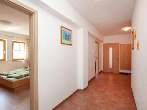 a room with a bed and a hallway at Stunning Apartment near Forest in Mittersill in Mittersill