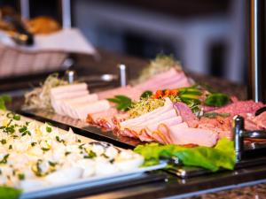a buffet with many different types of food on display at Rewita Międzyzdroje Neptun in Międzyzdroje +6 photos
