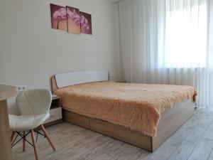 Posteľ alebo postele v izbe v ubytovaní Apartment Kiev Studio with city view