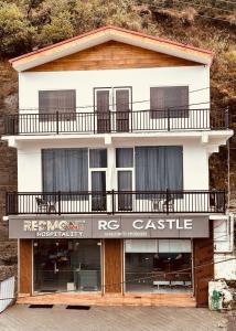 a building with a balcony on top of it at RG Castle in Mussoorie