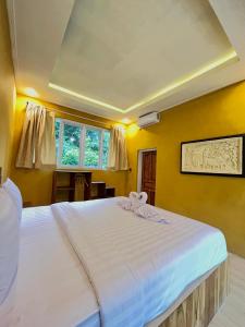 Voodi või voodid majutusasutuse BAMBOO OASIS toas