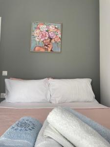 Postel nebo postele na pokoji v ubytování IRIS Apartment