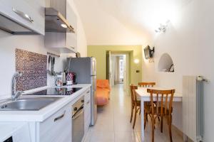 Кухня или кухненски бокс в Corte d'Appello Rooms