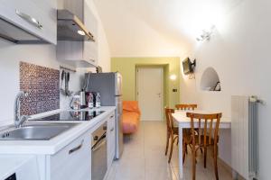 Kuchyň nebo kuchyňský kout v ubytování Corte d'Appello Rooms