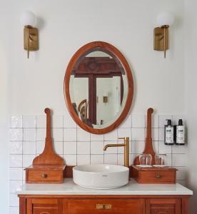 a bathroom with a sink and a mirror at Casa Palacio Reina de Tardajos in Vinuesa