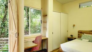 Postel nebo postele na pokoji v ubytování Banofi Hills - dream getaway for nature lovers