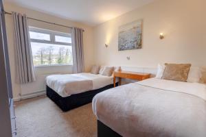 Katil atau katil-katil dalam bilik di Killarney View House B&B