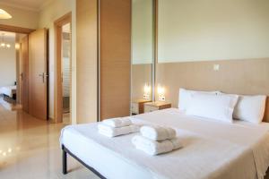 Postel nebo postele na pokoji v ubytování Voula Villa Agios Ioannis 2 + 24 fotografií