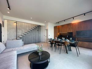 a living room with a couch and a table at Villa Adele in Polychrono