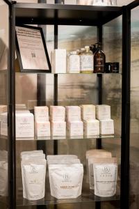a display case filled with lots of white products at Kyriad Prestige Residence & Spa Cabourg-Dives-sur-Mer in Dives-sur-Mer