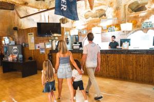 a group of people walking through a restaurant at Magic Aqua Rock Gardens in Benidorm +143 photos