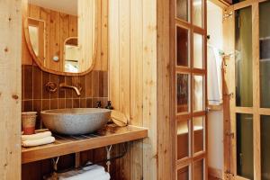 a bathroom with a sink and a mirror at Treehouse Hotel Manchester in Manchester