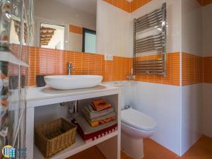 a bathroom with a sink and a toilet at Villa colette in Sant Antoni de Calonge