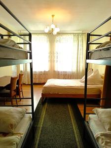 Posteľ alebo postele v izbe v ubytovaní Hostel Omega