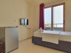 Postel nebo postele na pokoji v ubytování Mintt Hotel