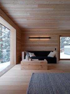 Un pat sau paturi într-o cameră la Mountain Lodge Tamersc