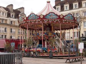 a carousel in front of a building at Le Cosy - Centre Ville - 2 pièces in Beauvais
