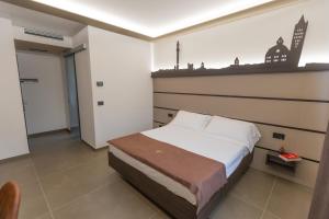 Postel nebo postele na pokoji v ubytování Palace Hotel Due Ponti