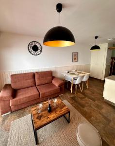 a living room with a couch and a table at Frontera Blanca Superior in Pas de la Casa