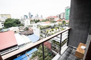 a balcony with a view of a city at PATIO Hotel & Urban Resort in Phnom Penh