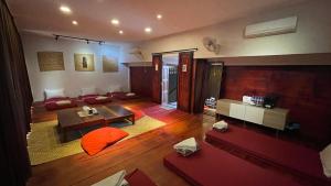 a living room with a couch and a table at Rocky Cafe & Mini Apartment in Siem Reap