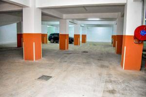 an empty parking garage with a car parked in it at Mogul's Palace (3 beds) Thika town in Thika
