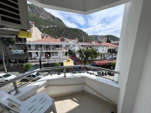 a balcony with a view of a city and mountains at Mimosa Pension in Kas