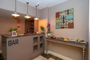 a bar in a restaurant with food on a counter at Raymond Hotel in Istanbul