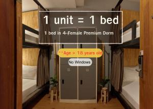 a sign that says unit bed in a female premium room at Timber Hostel in Bangkok