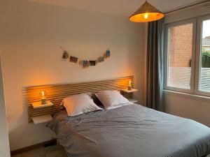 Postel nebo postele na pokoji v ubytování Au 154 Bis - Bel appartement - Le Jardin