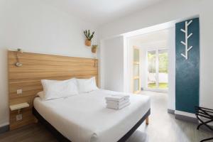 Postel nebo postele na pokoji v ubytování L'Oasis Hotel + 37 fotografií
