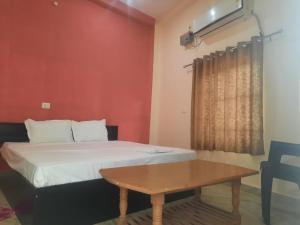 Postel nebo postele na pokoji v ubytování Sky inn paying guest house