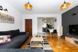 a living room with a couch and a table at Apartment Nea Zadar in Zadar