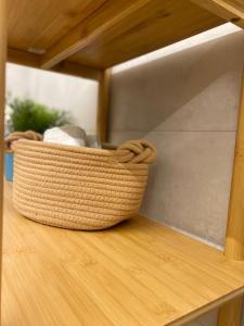 a basket sitting on top of a wooden table at Atrium in Castellammare del Golfo