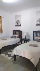 Ένα ή περισσότερα κρεβάτια σε δωμάτιο στο Paperbark Self Catering Units