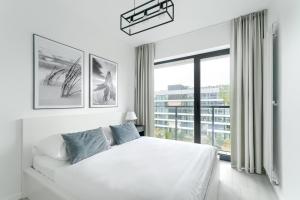 Katil atau katil-katil dalam bilik di Shellter City Apartments