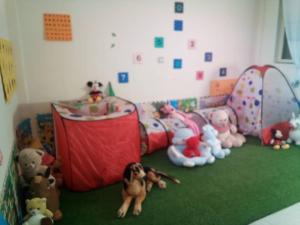 a room with a bunch of stuffed animals on the floor at Cozy Private Room at a Homestay with Facilities in Addis Ababa