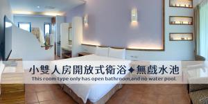 Voodi või voodid majutusasutuse Ding Jia Garden Resort toas