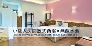 Voodi või voodid majutusasutuse Ding Jia Garden Resort toas