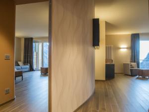 A bed or beds in a room at Hotel Belvedere Wellness&SPA